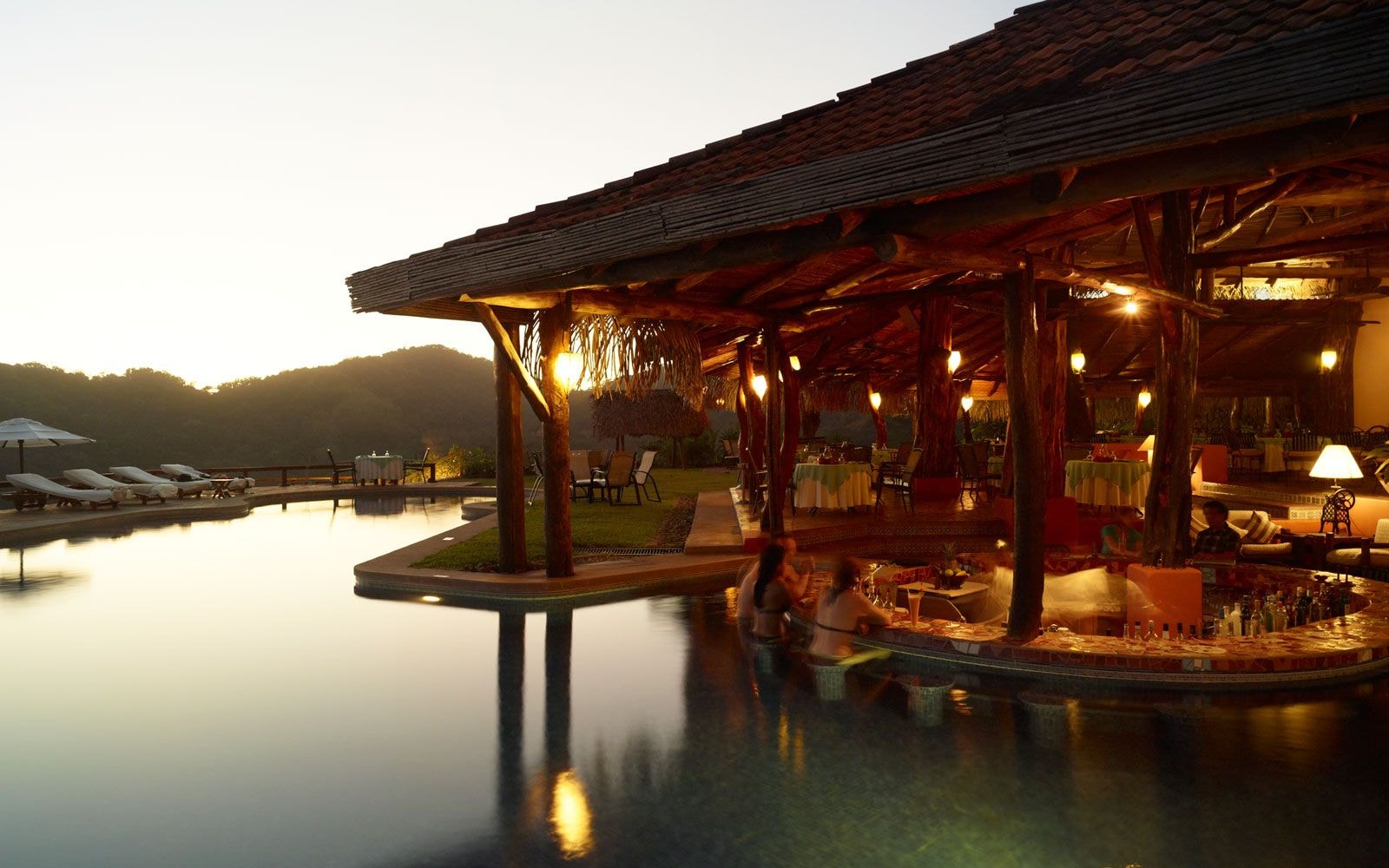 Infinity pool surrounded by tropical rainforest